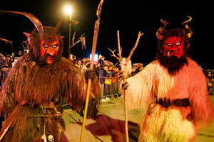 Krampusse pose for a photo during a Krampus run. More than 600 Krampuses from Slovenia, Austria, Italy, and Croatia joined the tenth anniversary of the Krampus run in Goričane. Krampus, a horned demon-like figure, traditionally works alongside Saint Nicholas or Santa Claus. While Santa rewards good children with gifts, Krampus scares and gives birch rods to misbehaving children. The Krampus run aims to remind both children and adults who haven't been well-behaved to improve their behavior before Christmas.