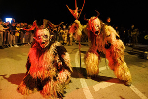 Krampusse pose for a photo during a Krampus run. More than 600 Krampuses from Slovenia, Austria, Italy, and Croatia joined the tenth anniversary of the Krampus run in Goričane. Krampus, a horned demon-like figure, traditionally works alongside Saint Nicholas or Santa Claus. While Santa rewards good children with gifts, Krampus scares and gives birch rods to misbehaving children. The Krampus run aims to remind both children and adults who haven't been well-behaved to improve their behavior before Christmas.