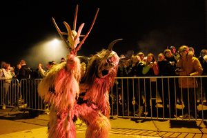 A Krampus poses for a photo during a Krampus run. More than 600 Krampuses from Slovenia, Austria, Italy, and Croatia joined the tenth anniversary of the Krampus run in Goričane. Krampus, a horned demon-like figure, traditionally works alongside Saint Nicholas or Santa Claus. While Santa rewards good children with gifts, Krampus scares and gives birch rods to misbehaving children. The Krampus run aims to remind both children and adults who haven't been well-behaved to improve their behavior before Christmas.