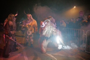Krampusse perform during a Krampus run. More than 600 Krampuses from Slovenia, Austria, Italy, and Croatia joined the tenth anniversary of the Krampus run in Goričane. Krampus, a horned demon-like figure, traditionally works alongside Saint Nicholas or Santa Claus. While Santa rewards good children with gifts, Krampus scares and gives birch rods to misbehaving children. The Krampus run aims to remind both children and adults who haven't been well-behaved to improve their behavior before Christmas.
