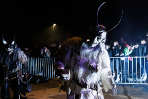 A Krampus poses for a photo during a Krampus run. More than 600 Krampuses from Slovenia, Austria, Italy, and Croatia joined the tenth anniversary of the Krampus run in Goričane. Krampus, a horned demon-like figure, traditionally works alongside Saint Nicholas or Santa Claus. While Santa rewards good children with gifts, Krampus scares and gives birch rods to misbehaving children. The Krampus run aims to remind both children and adults who haven't been well-behaved to improve their behavior before Christmas.