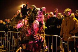 A Krampus poses for a photo during a Krampus run. More than 600 Krampuses from Slovenia, Austria, Italy, and Croatia joined the tenth anniversary of the Krampus run in Goričane. Krampus, a horned demon-like figure, traditionally works alongside Saint Nicholas or Santa Claus. While Santa rewards good children with gifts, Krampus scares and gives birch rods to misbehaving children. The Krampus run aims to remind both children and adults who haven't been well-behaved to improve their behavior before Christmas.
