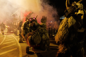 Krampusse walk by during a Krampus run. More than 600 Krampuses from Slovenia, Austria, Italy, and Croatia joined the tenth anniversary of the Krampus run in Goričane. Krampus, a horned demon-like figure, traditionally works alongside Saint Nicholas or Santa Claus. While Santa rewards good children with gifts, Krampus scares and gives birch rods to misbehaving children. The Krampus run aims to remind both children and adults who haven't been well-behaved to improve their behavior before Christmas.
