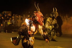 A Krampus performs during a Krampus run. More than 600 Krampuses from Slovenia, Austria, Italy, and Croatia joined the tenth anniversary of the Krampus run in Goričane. Krampus, a horned demon-like figure, traditionally works alongside Saint Nicholas or Santa Claus. While Santa rewards good children with gifts, Krampus scares and gives birch rods to misbehaving children. The Krampus run aims to remind both children and adults who haven't been well-behaved to improve their behavior before Christmas.