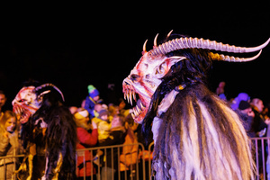 Krampusse walk by during a Krampus run. More than 600 Krampuses from Slovenia, Austria, Italy, and Croatia joined the tenth anniversary of the Krampus run in Goričane. Krampus, a horned demon-like figure, traditionally works alongside Saint Nicholas or Santa Claus. While Santa rewards good children with gifts, Krampus scares and gives birch rods to misbehaving children. The Krampus run aims to remind both children and adults who haven't been well-behaved to improve their behavior before Christmas.