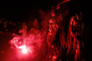 A Krampus performs during a Krampus run. More than 600 Krampuses from Slovenia, Austria, Italy, and Croatia joined the tenth anniversary of the Krampus run in Goričane. Krampus, a horned demon-like figure, traditionally works alongside Saint Nicholas or Santa Claus. While Santa rewards good children with gifts, Krampus scares and gives birch rods to misbehaving children. The Krampus run aims to remind both children and adults who haven't been well-behaved to improve their behavior before Christmas.