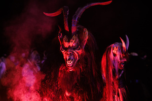 A Krampus performs during a Krampus run. More than 600 Krampuses from Slovenia, Austria, Italy, and Croatia joined the tenth anniversary of the Krampus run in Goričane. Krampus, a horned demon-like figure, traditionally works alongside Saint Nicholas or Santa Claus. While Santa rewards good children with gifts, Krampus scares and gives birch rods to misbehaving children. The Krampus run aims to remind both children and adults who haven't been well-behaved to improve their behavior before Christmas.