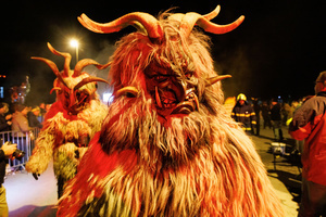 A Krampus walks by during a Krampus run. More than 600 Krampuses from Slovenia, Austria, Italy, and Croatia joined the tenth anniversary of the Krampus run in Goričane. Krampus, a horned demon-like figure, traditionally works alongside Saint Nicholas or Santa Claus. While Santa rewards good children with gifts, Krampus scares and gives birch rods to misbehaving children. The Krampus run aims to remind both children and adults who haven't been well-behaved to improve their behavior before Christmas.