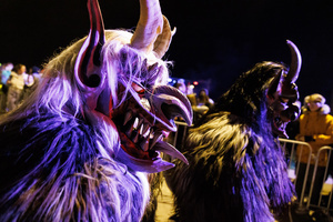 Krampusse walk by during a Krampus run. More than 600 Krampuses from Slovenia, Austria, Italy, and Croatia joined the tenth anniversary of the Krampus run in Goričane. Krampus, a horned demon-like figure, traditionally works alongside Saint Nicholas or Santa Claus. While Santa rewards good children with gifts, Krampus scares and gives birch rods to misbehaving children. The Krampus run aims to remind both children and adults who haven't been well-behaved to improve their behavior before Christmas.