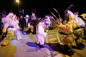 Krampusse perform during a Krampus run. More than 600 Krampuses from Slovenia, Austria, Italy, and Croatia joined the tenth anniversary of the Krampus run in Goričane. Krampus, a horned demon-like figure, traditionally works alongside Saint Nicholas or Santa Claus. While Santa rewards good children with gifts, Krampus scares and gives birch rods to misbehaving children. The Krampus run aims to remind both children and adults who haven't been well-behaved to improve their behavior before Christmas.