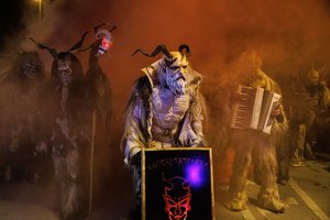 Krampusse walk by during a Krampus run. More than 600 Krampuses from Slovenia, Austria, Italy, and Croatia joined the tenth anniversary of the Krampus run in Goričane. Krampus, a horned demon-like figure, traditionally works alongside Saint Nicholas or Santa Claus. While Santa rewards good children with gifts, Krampus scares and gives birch rods to misbehaving children. The Krampus run aims to remind both children and adults who haven't been well-behaved to improve their behavior before Christmas.