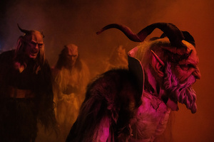 Krampusse walk by during a Krampus run. More than 600 Krampuses from Slovenia, Austria, Italy, and Croatia joined the tenth anniversary of the Krampus run in Goričane. Krampus, a horned demon-like figure, traditionally works alongside Saint Nicholas or Santa Claus. While Santa rewards good children with gifts, Krampus scares and gives birch rods to misbehaving children. The Krampus run aims to remind both children and adults who haven't been well-behaved to improve their behavior before Christmas.