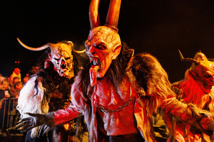 Krampusse pose for a photo during a Krampus run. More than 600 Krampuses from Slovenia, Austria, Italy, and Croatia joined the tenth anniversary of the Krampus run in Goričane. Krampus, a horned demon-like figure, traditionally works alongside Saint Nicholas or Santa Claus. While Santa rewards good children with gifts, Krampus scares and gives birch rods to misbehaving children. The Krampus run aims to remind both children and adults who haven't been well-behaved to improve their behavior before Christmas.