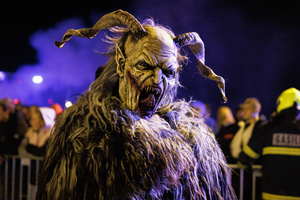 A Krampus poses for a photo during a Krampus run. More than 600 Krampuses from Slovenia, Austria, Italy, and Croatia joined the tenth anniversary of the Krampus run in Goričane. Krampus, a horned demon-like figure, traditionally works alongside Saint Nicholas or Santa Claus. While Santa rewards good children with gifts, Krampus scares and gives birch rods to misbehaving children. The Krampus run aims to remind both children and adults who haven't been well-behaved to improve their behavior before Christmas.