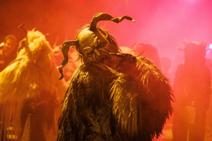 A Krampus poses for a photo during a Krampus run. More than 600 Krampuses from Slovenia, Austria, Italy, and Croatia joined the tenth anniversary of the Krampus run in Goričane. Krampus, a horned demon-like figure, traditionally works alongside Saint Nicholas or Santa Claus. While Santa rewards good children with gifts, Krampus scares and gives birch rods to misbehaving children. The Krampus run aims to remind both children and adults who haven't been well-behaved to improve their behavior before Christmas.