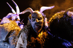 A Krampus poses for a photo during a Krampus run. More than 600 Krampuses from Slovenia, Austria, Italy, and Croatia joined the tenth anniversary of the Krampus run in Goričane. Krampus, a horned demon-like figure, traditionally works alongside Saint Nicholas or Santa Claus. While Santa rewards good children with gifts, Krampus scares and gives birch rods to misbehaving children. The Krampus run aims to remind both children and adults who haven't been well-behaved to improve their behavior before Christmas.