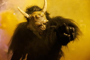 A Krampus poses for a photo during a Krampus run. More than 600 Krampuses from Slovenia, Austria, Italy, and Croatia joined the tenth anniversary of the Krampus run in Goričane. Krampus, a horned demon-like figure, traditionally works alongside Saint Nicholas or Santa Claus. While Santa rewards good children with gifts, Krampus scares and gives birch rods to misbehaving children. The Krampus run aims to remind both children and adults who haven't been well-behaved to improve their behavior before Christmas.