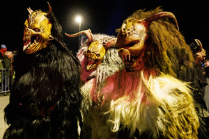 Krampusse pose for a photo during a Krampus run. More than 600 Krampuses from Slovenia, Austria, Italy, and Croatia joined the tenth anniversary of the Krampus run in Goričane. Krampus, a horned demon-like figure, traditionally works alongside Saint Nicholas or Santa Claus. While Santa rewards good children with gifts, Krampus scares and gives birch rods to misbehaving children. The Krampus run aims to remind both children and adults who haven't been well-behaved to improve their behavior before Christmas.