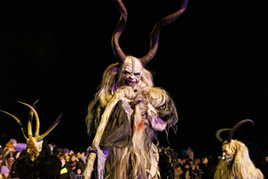 A Krampus poses for a photo during a Krampus run. More than 600 Krampuses from Slovenia, Austria, Italy, and Croatia joined the tenth anniversary of the Krampus run in Goričane. Krampus, a horned demon-like figure, traditionally works alongside Saint Nicholas or Santa Claus. While Santa rewards good children with gifts, Krampus scares and gives birch rods to misbehaving children. The Krampus run aims to remind both children and adults who haven't been well-behaved to improve their behavior before Christmas.