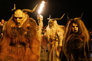 Krampuses walk by during a Krampus run. More than 600 Krampuses from Slovenia, Austria, Italy, and Croatia joined the tenth anniversary of the Krampus run in Goričane. Krampus, a horned demon-like figure, traditionally works alongside Saint Nicholas or Santa Claus. While Santa rewards good children with gifts, Krampus scares and gives birch rods to misbehaving children. The Krampus run aims to remind both children and adults who haven't been well-behaved to improve their behavior before Christmas.