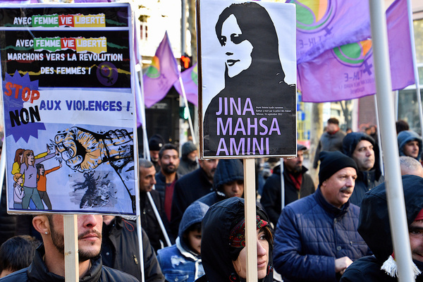 During the demonstration, a Kurdish female protester holds a placard with an image of the young Iranian Kurdish woman, Jina Mahsa Amini beaten to death by the morality police in Tehran on September 16, 2022. Dozens of Kurdish protesters assembled in Marseille, marching through the streets to demand an end to violence against women on the International Day for the Elimination of Violence Against Women.