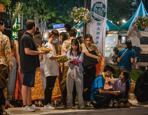 Thai and foreigners are seen with their krathong on the bank of the lake during the Magical Loy Krathong Festival at Jodd Fairs Dan Neramit in Bangkok. Loy Krathong, Thailand's Festival of Lights, is celebrated annually across Thailand and nearby regions. During this festival, people float decorated baskets made of banana leaves, incense sticks, and candles on rivers, canals, or ponds. They make wishes as they release these baskets.