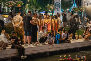 Thai and foreigners are seen with their krathongs during the Magical Loy Krathong Festival at Jodd Fairs Dan Neramit in Bangkok. Loy Krathong, Thailand's Festival of Lights, is celebrated annually across Thailand and nearby regions. During this festival, people float decorated baskets made of banana leaves, incense sticks, and candles on rivers, canals, or ponds. They make wishes as they release these floating offerings.