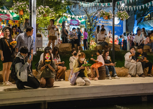 Thai and foreigners are seen praying in front of their krathong before putting it on the lake during the Magical Loy Krathong Festival at Jodd Fairs Dan Neramit in Bangkok. Loy Krathong, Thailand's Festival of Lights, is celebrated annually across Thailand and nearby regions. During this festival, people float decorated baskets made of banana leaves, incense sticks, and candles on rivers, canals, or ponds. They make wishes as they release these baskets.