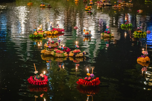 Krathongs are seen floating in the lake during the Magical Loy Krathong Festival at Jodd Fairs Dan Neramit in Bangkok. Loy Krathong, Thailand's Festival of Lights, is celebrated annually across Thailand and nearby regions. During this festival, people float decorated baskets made of banana leaves, incense sticks, and candles on rivers, canals, or ponds. They make wishes as they release these floating offerings.