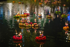 Krathongs are seen floating in the lake during the Magical Loy Krathong Festival at Jodd Fairs Dan Neramit in Bangkok. Loy Krathong, Thailand's Festival of Lights, is celebrated annually across Thailand and nearby regions. During this festival, people float decorated baskets made of banana leaves, incense sticks, and candles on rivers, canals, or ponds. They make wishes as they release these floating offerings.
