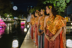 Thai women in traditional costumes are seen during the Magical Loy Krathong Festival at Jodd Fairs Dan Neramit in Bangkok. Loy Krathong, Thailand's Festival of Lights, is celebrated annually across Thailand and nearby regions. During this festival, people float decorated baskets made of banana leaves, incense sticks, and candles on rivers, canals, or ponds. They make wishes as they release these floating offerings.