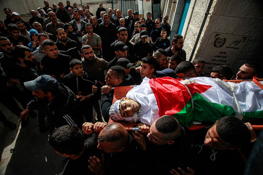 (EDITORS NOTE: Image depicts death)
Mourners carry the body of one of the five Palestinians killed in the occupied West Bank city of Jenin in an overnight Israeli incursion, during their funeral. Five people were killed by Israeli army fire in Jenin, the Palestinian health ministry said, during an incursion by a large number of armored vehicles into the city, which was recently the scene of the deadliest Israeli raid in the West Bank in almost 20 years.