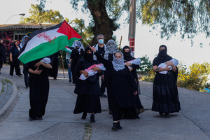 Female protesters dummy babies wrapped in fake blood-stained clothes during the demonstration. Protesters participate in a rally in the city of Valparaiso in Chile to mark the International Day of Solidarity with the Palestinian People, condemning Israel’s war on Gaza and calling for a permanent ceasefire. This day is observed annually on November 29 to remember Resolution 181, when the UN decided in 1947 to divide Palestine into two separate Jewish and Arab states.