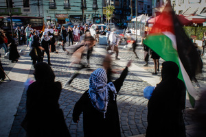 Protesters take part during the demonstration. Protesters participate in a rally in the city of Valparaiso in Chile to mark the International Day of Solidarity with the Palestinian People, condemning Israel’s war on Gaza and calling for a permanent ceasefire. This day is observed annually on November 29 to remember Resolution 181, when the UN decided in 1947 to divide Palestine into two separate Jewish and Arab states.