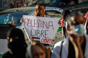 A protester holds a placard that says, "Free Palestine" during the demonstration. Protesters participate in a rally in the city of Valparaiso in Chile to mark the International Day of Solidarity with the Palestinian People, condemning Israel’s war on Gaza and calling for a permanent ceasefire. This day is observed annually on November 29 to remember Resolution 181, when the UN decided in 1947 to divide Palestine into two separate Jewish and Arab states.