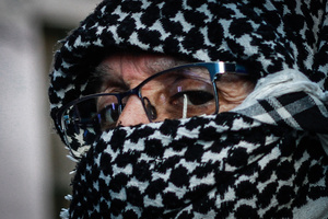 A protester wearing a keffiyeh takes part during the demonstration. Protesters participate in a rally in the city of Valparaiso in Chile to mark the International Day of Solidarity with the Palestinian People, condemning Israel’s war on Gaza and calling for a permanent ceasefire. This day is observed annually on November 29 to remember Resolution 181, when the UN decided in 1947 to divide Palestine into two separate Jewish and Arab states.