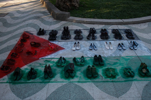 Palestinian flag with shoes seen displayed during the demonstration. Protesters participate in a rally in the city of Valparaiso in Chile to mark the International Day of Solidarity with the Palestinian People, condemning Israel’s war on Gaza and calling for a permanent ceasefire. This day is observed annually on November 29 to remember Resolution 181, when the UN decided in 1947 to divide Palestine into two separate Jewish and Arab states.