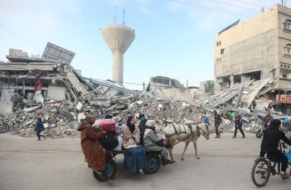 Palestinians ride on the back of a cart as they move towards safer areas following the resumption of Israeli strikes on Rafah in the southern Gaza Strip, after the expiration of a seven-day truce between Israel and Hamas militants. A temporary truce between Israel and Hamas expired on December 1, with the Israeli army saying combat operations had resumed, accusing Hamas of violating the operational pause.