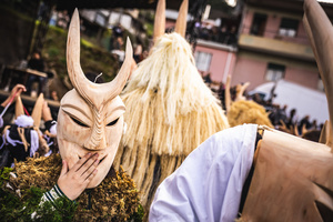 A Careto seen during the Carnival parade in Lazarim. In Lazarim, northern Portugal, the carnival is celebrated with a tradition known as Entrudo. During this festivity, masks of devils and demons, intricately carved in wood by the village's craftsmen, are prominently featured. The carnival parade through the streets showcases these masks, portraying ancestral scenes of Portuguese culture.