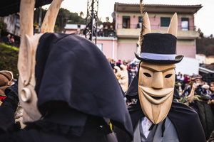 A Careto poses for a photo during the Carnival parade in Lazarim. In Lazarim, northern Portugal, the carnival is celebrated with a tradition known as Entrudo. During this festivity, masks of devils and demons, intricately carved in wood by the village's craftsmen, are prominently featured. The carnival parade through the streets showcases these masks, portraying ancestral scenes of Portuguese culture.