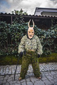 A Careto poses for a photo during the Lazarim carnival. In Lazarim, northern Portugal, the carnival is celebrated with a tradition known as Entrudo. During this festivity, masks of devils and demons, intricately carved in wood by the village's craftsmen, are prominently featured. The carnival parade through the streets showcases these masks, portraying ancestral scenes of Portuguese culture.