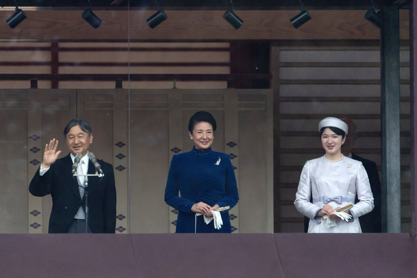 Japan's Emperor Naruhito (L) waves as Empress Masako (C) and their daughter Princess Aiko (R) look on on the balcony of the Imperial Palace on February 23, 2024, in Tokyo, Japan. Emperor Naruhito appeared to greet the public on his 64th birthday, flanked by Empress Masako and other members of the Japanese Royal Family.