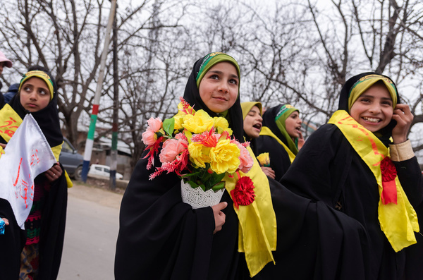 Kashmiri Shia Muslims hold flowers in hands as they walk during a rally celebrating the birth of Imam Mahdi. The rally held in Kashmir today, on the 15th of Sha'aban, the eighth month of the Islamic calendar, commemorates the birth of the final Shia Imam, Muhammad al-Mahdi. According to Shia Muslims, he is believed to emerge before the end of time to establish peace and justice in the world.