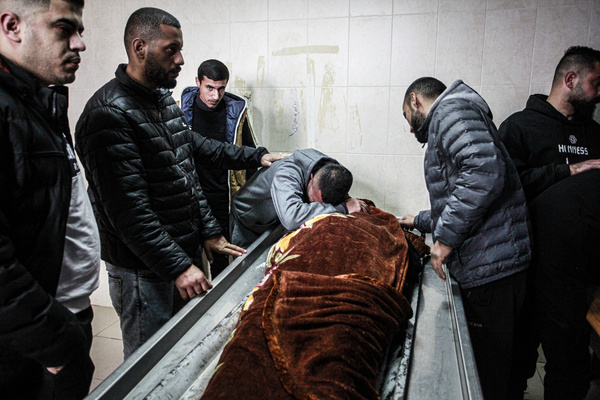 (EDITOR'S NOTE: Image depicts death) 
Palestinians mourn one of three men killed by Israeli troops in Faraa refugee camp, at the morgue in the West Bank town. Israeli troops shot and killed three Palestinian men including Daraghmeh, in the northern town of Tubas.