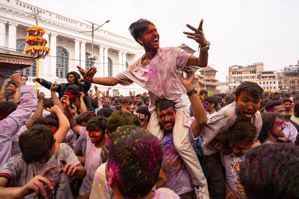 Nepalese people celebrate Holi festival in Kathmandu, Nepal. Holi festival also known as the Festival of Colors is celebrated for the victory of good over evil and the coming of spring season.