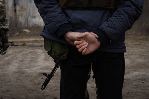 A trainee holds his hand on the back while listening to a military instructor in a training organised by the third separate assault brigade in Kyiv region. Ukraine is facing a shortage of ammunition and military personnel. Aside from a tougher mobilisation law is under way, some brigades in the country have chosen a more encouraging approach to recruit people without previous military experience to join the army. The third separate assault brigade offers a 7-day free training course advertises to allow participants to have a taste of military training, enabling them to find their place in the army according to their skills and ability. Participants here are as young as 18 years old. 

When the war between Ukraine and Russia grind on for the second year mark, Ukraine president Volodymyr Zelensky revealed in last December the military wants to mobilise an extra 500,000 people.