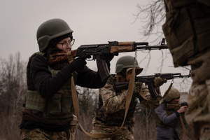 A young female trainee is seen in a shooting position in a training organised by the third separate assault brigade in Kyiv region. Ukraine is facing a shortage of ammunition and military personnel. Aside from a tougher mobilisation law is under way, some brigades in the country have chosen a more encouraging approach to recruit people without previous military experience to join the army. The third separate assault brigade offers a 7-day free training course advertises to allow participants to have a taste of military training, enabling them to find their place in the army according to their skills and ability. Participants here are as young as 18 years old. 

When the war between Ukraine and Russia grind on for the second year mark, Ukraine president Volodymyr Zelensky revealed in last December the military wants to mobilise an extra 500,000 people.