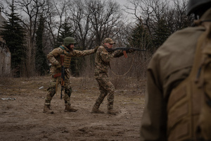 A military instructor is seen demonstrating in a training organised by the third separate assault brigade in Kyiv region. Ukraine is facing a shortage of ammunition and military personnel. Aside from a tougher mobilisation law is under way, some brigades in the country have chosen a more encouraging approach to recruit people without previous military experience to join the army. The third separate assault brigade offers a 7-day free training course advertises to allow participants to have a taste of military training, enabling them to find their place in the army according to their skills and ability. Participants here are as young as 18 years old. 

When the war between Ukraine and Russia grind on for the second year mark, Ukraine president Volodymyr Zelensky revealed in last December the military wants to mobilise an extra 500,000 people.
