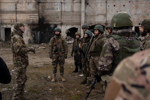 A group of trainees listens to the military instructor in a training organised by the third separate assault brigade in Kyiv region. Ukraine is facing a shortage of ammunition and military personnel. Aside from a tougher mobilisation law is under way, some brigades in the country have chosen a more encouraging approach to recruit people without previous military experience to join the army. The third separate assault brigade offers a 7-day free training course advertises to allow participants to have a taste of military training, enabling them to find their place in the army according to their skills and ability. Participants here are as young as 18 years old. 

When the war between Ukraine and Russia grind on for the second year mark, Ukraine president Volodymyr Zelensky revealed in last December the military wants to mobilise an extra 500,000 people.