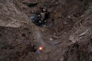 A trainee is seen in a training simulating an evacuation mission in the trenches with small explosive organised by the third separate assault brigade in Kyiv region. Ukraine is facing a shortage of ammunition and military personnel. Aside from a tougher mobilisation law is under way, some brigades in the country have chosen a more encouraging approach to recruit people without previous military experience to join the army. The third separate assault brigade offers a 7-day free training course advertises to allow participants to have a taste of military training, enabling them to find their place in the army according to their skills and ability. Participants here are as young as 18 years old. 

When the war between Ukraine and Russia grind on for the second year mark, Ukraine president Volodymyr Zelensky revealed in last December the military wants to mobilise an extra 500,000 people.